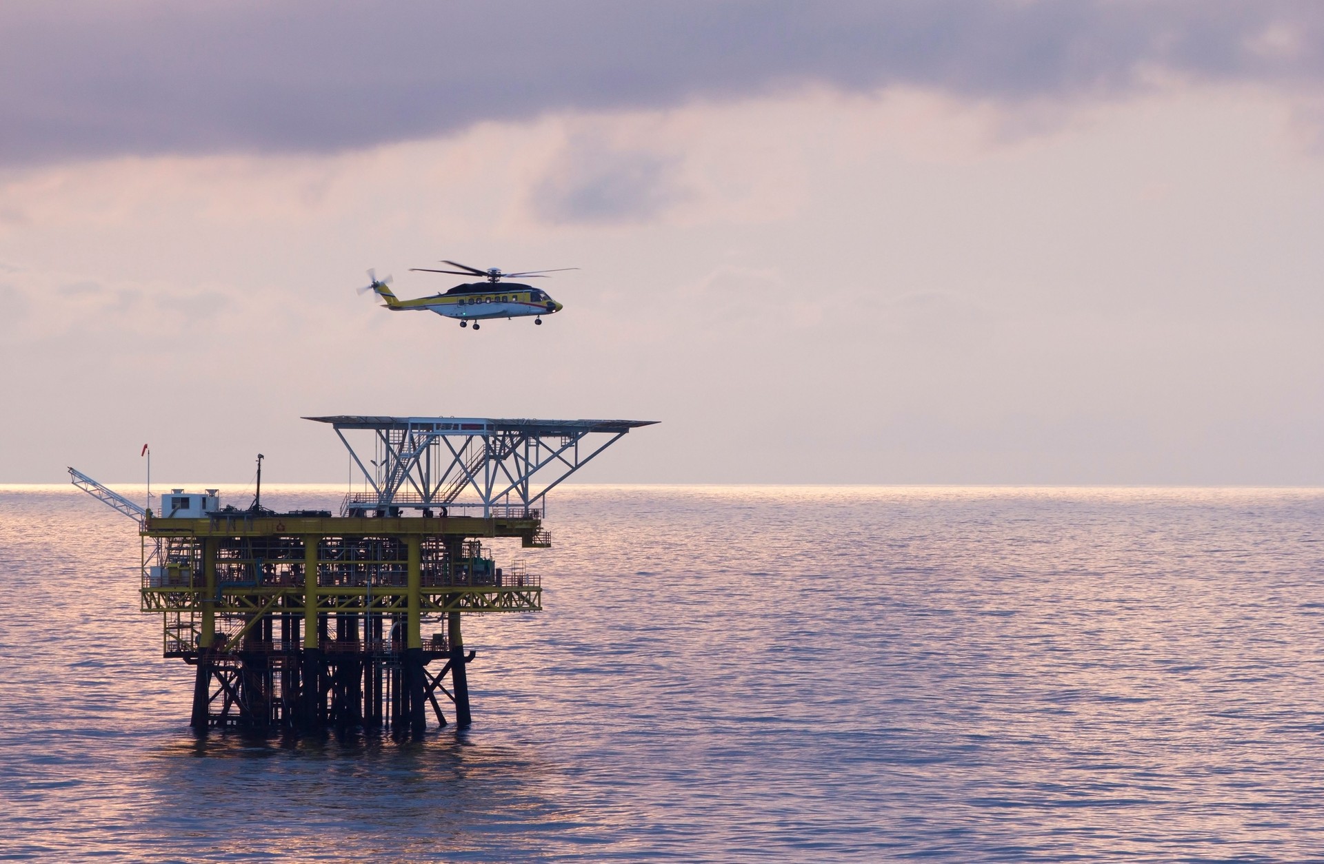 A helicopter and a rig